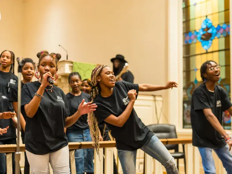 Singers dancing in choir at Bent But Not Broken Conference