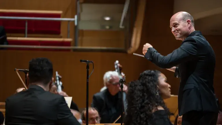 photo depicts Robert Istad conducting