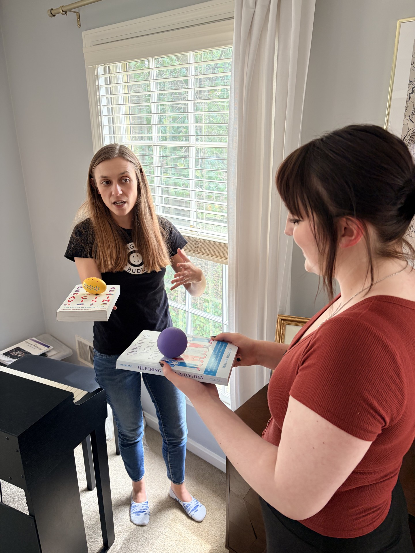Megan Durham exploring a somatic practice with with singer Marley Long. Photo credit by Wyatt Roberts