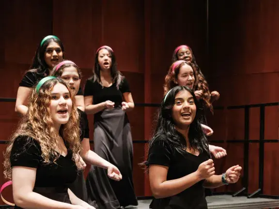 Girls in choir singing