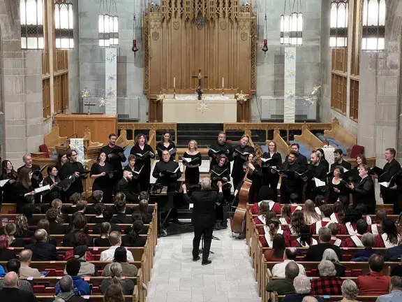 Jeffrey Hunt, founder and music director of the St. Charles Singers, conducts the mixed-voice chamber choir in concert at its home venue, Baker Memorial United Methodist Church,  St. Charles, Illinois.