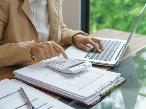 stock image of person using a calculator