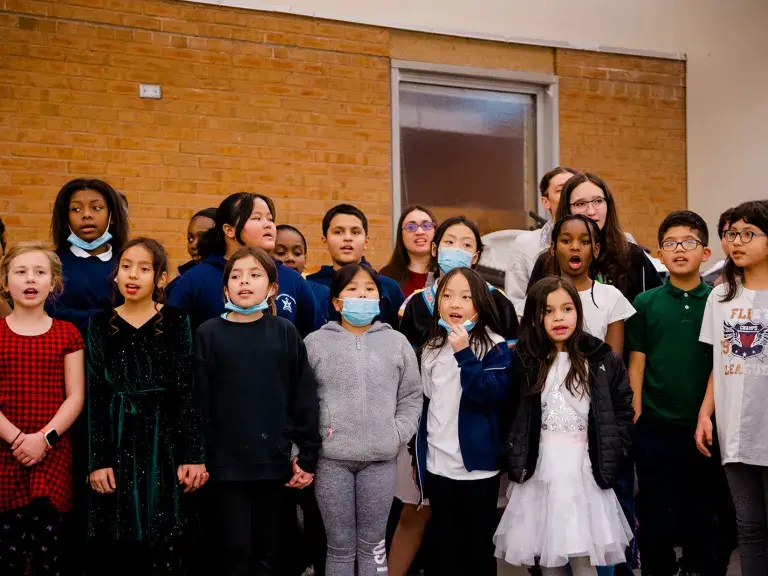 Border CrosSing education participants sing together