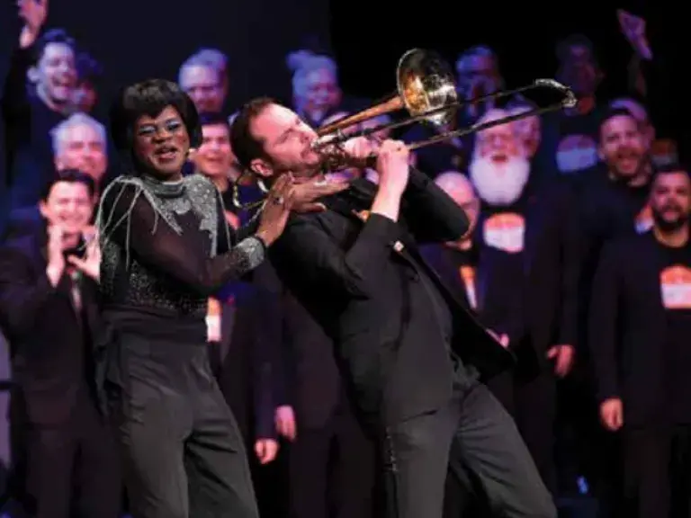 someone singing and someone playing the trumpet