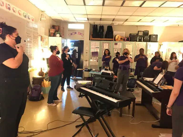 Students sing together in VOX Femina's social justice choir program