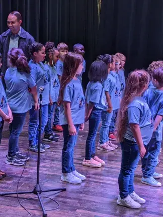 Adults and children sing together in Bluefield, WV