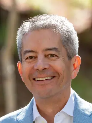 greg cheng smiling at camera