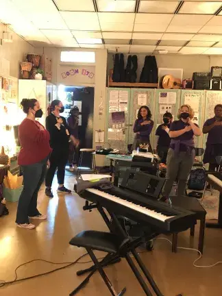 Students sing together in VOX Femina's social justice choir program