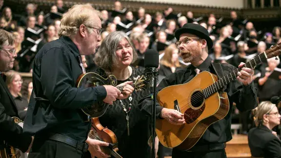 Bluegrass bands with instruments singing into one mic