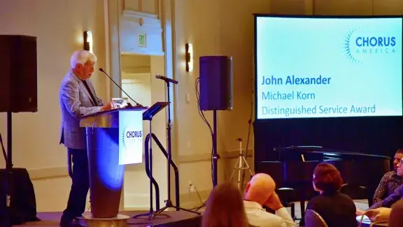 John Alexander accepting award